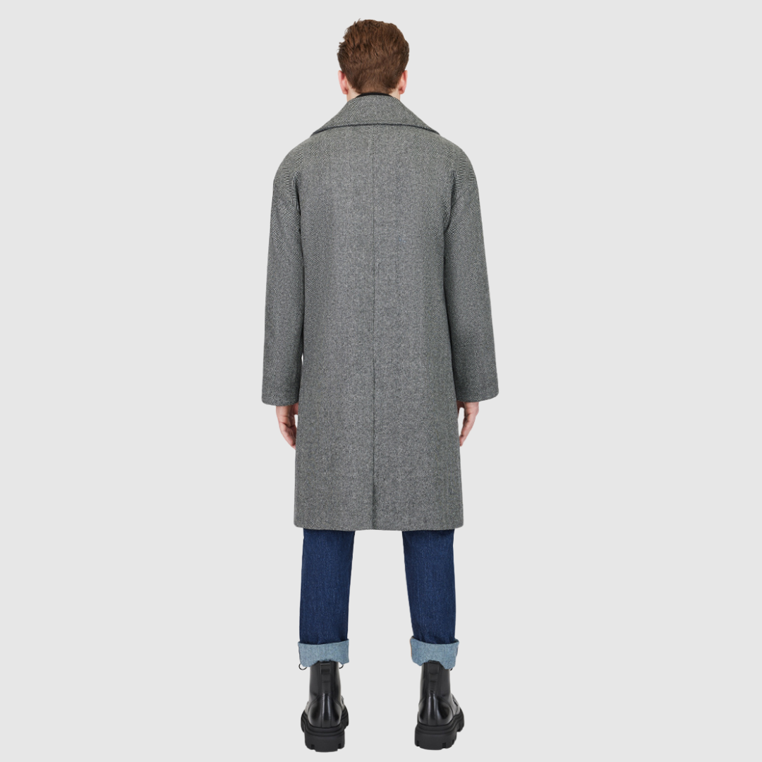 The James Herringbone Wool Cashmere Jacket is a luxurious Italian wool-cashmere blend designed for refined winter layering. Its double-breasted silhouette with drop shoulders and relaxed kimono gusset sleeves creates a sophisticated, heritage-inspired profile. Featuring a large notch collar, back vent, and single welt pockets, James offers both practicality and polished style for cold-weather dressing.