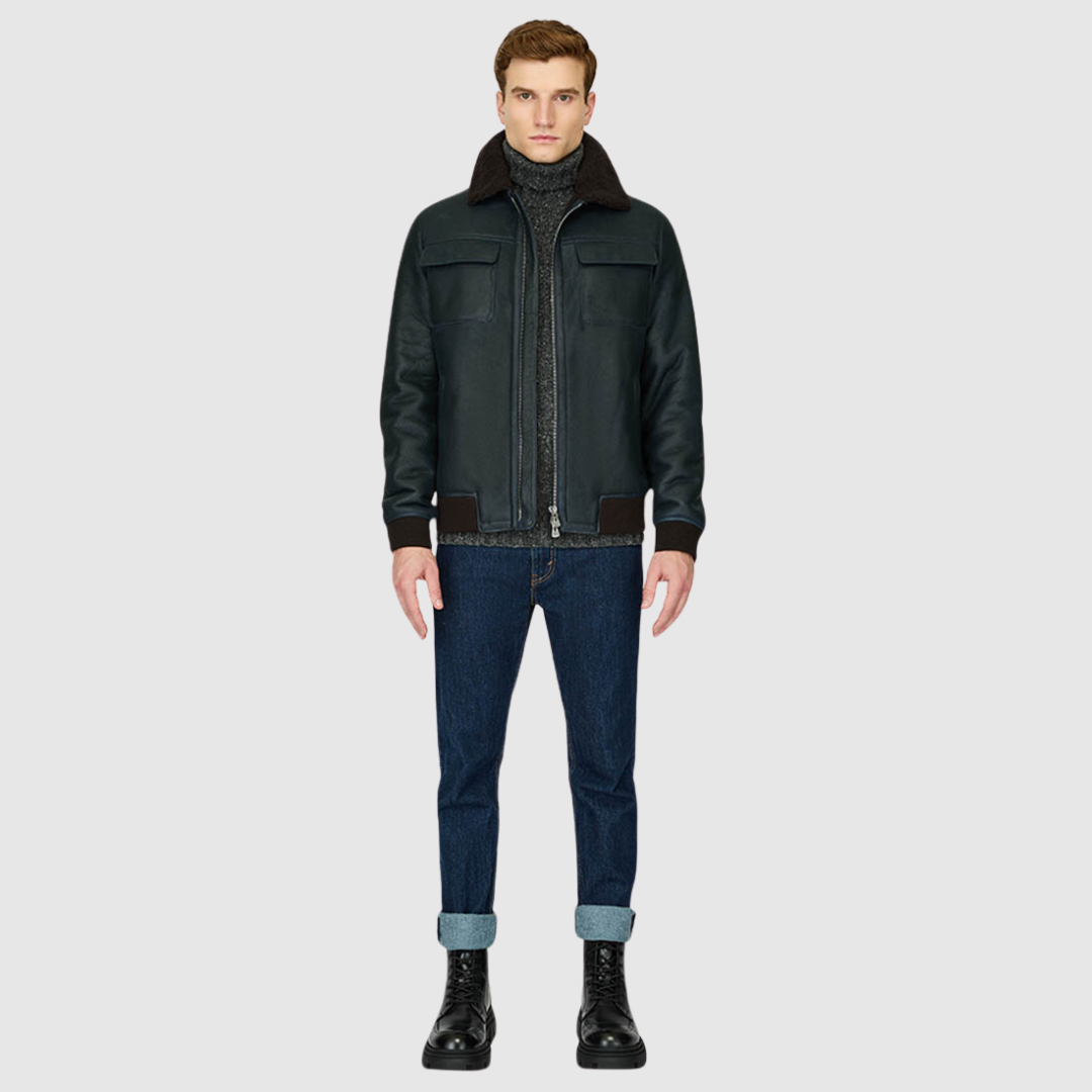 The Perez Navy Brown Shearling Bomber combines classic bomber styling with the luxury of supple nappa leather and a plush curly wool collar. Designed for a true-to-size fit, it features ribbed cuffs and a ribbed waistband for a secure, comfortable silhouette. Functional details such as zip side pockets and an interior zip pocket ensure everyday practicality, while the standard front zip closure keeps the design streamlined. Perez delivers timeless bomber attitude with a modern shearling upgrade.