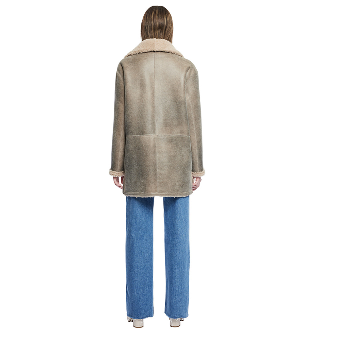Reversible nappa shacket Reverses to curly wool teddy Drop shoulder High-low hemline Notch collar Side zip pockets on nappa side Side patch pockets on curly wool side 4 button closure