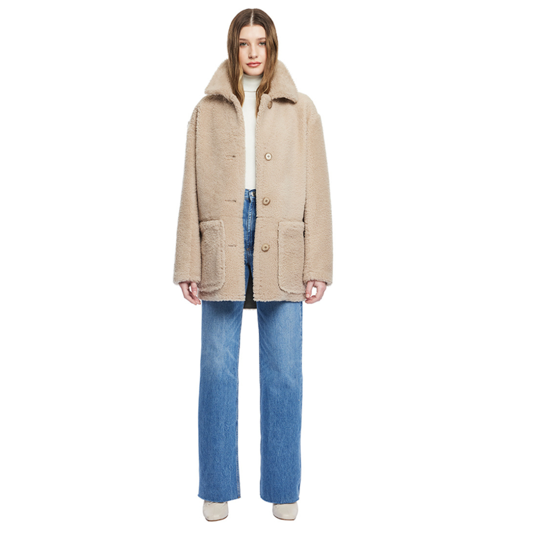 Reversible nappa shacket Reverses to curly wool teddy Drop shoulder High-low hemline Notch collar Side zip pockets on nappa side Side patch pockets on curly wool side 4 button closure