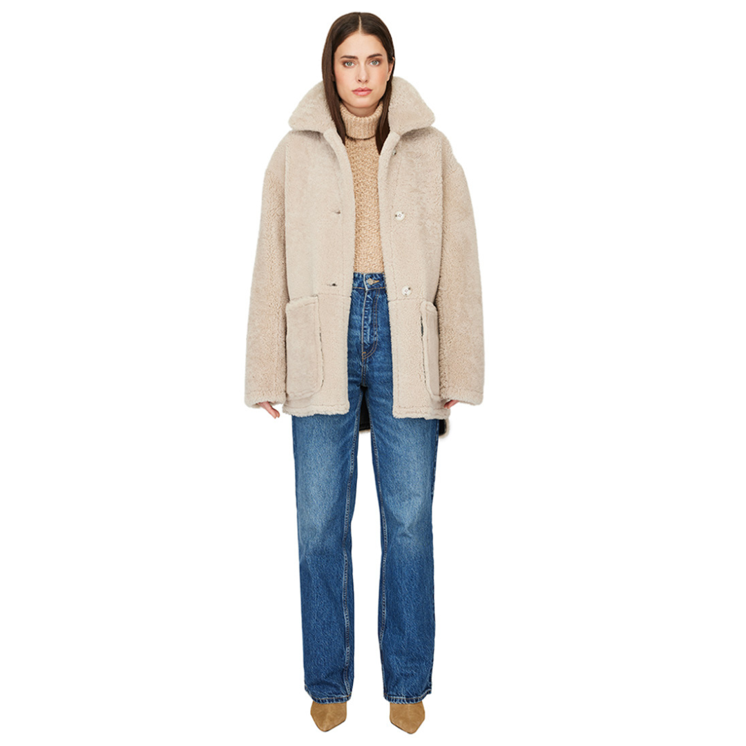 Reversible nappa shacket Reverses to curly wool teddy Drop shoulder High-low hemline Notch collar Side zip pockets on nappa side Side patch pockets on curly wool side 4 button closure