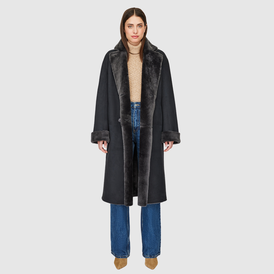 Reversible suede loose fitting coat Reverses to iron wool teddy Slight drop shoulder Double breasted button closure