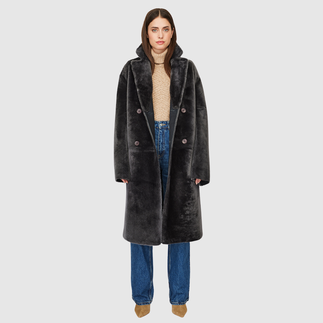 Reversible suede loose fitting coat Reverses to iron wool teddy Slight drop shoulder Double breasted button closure