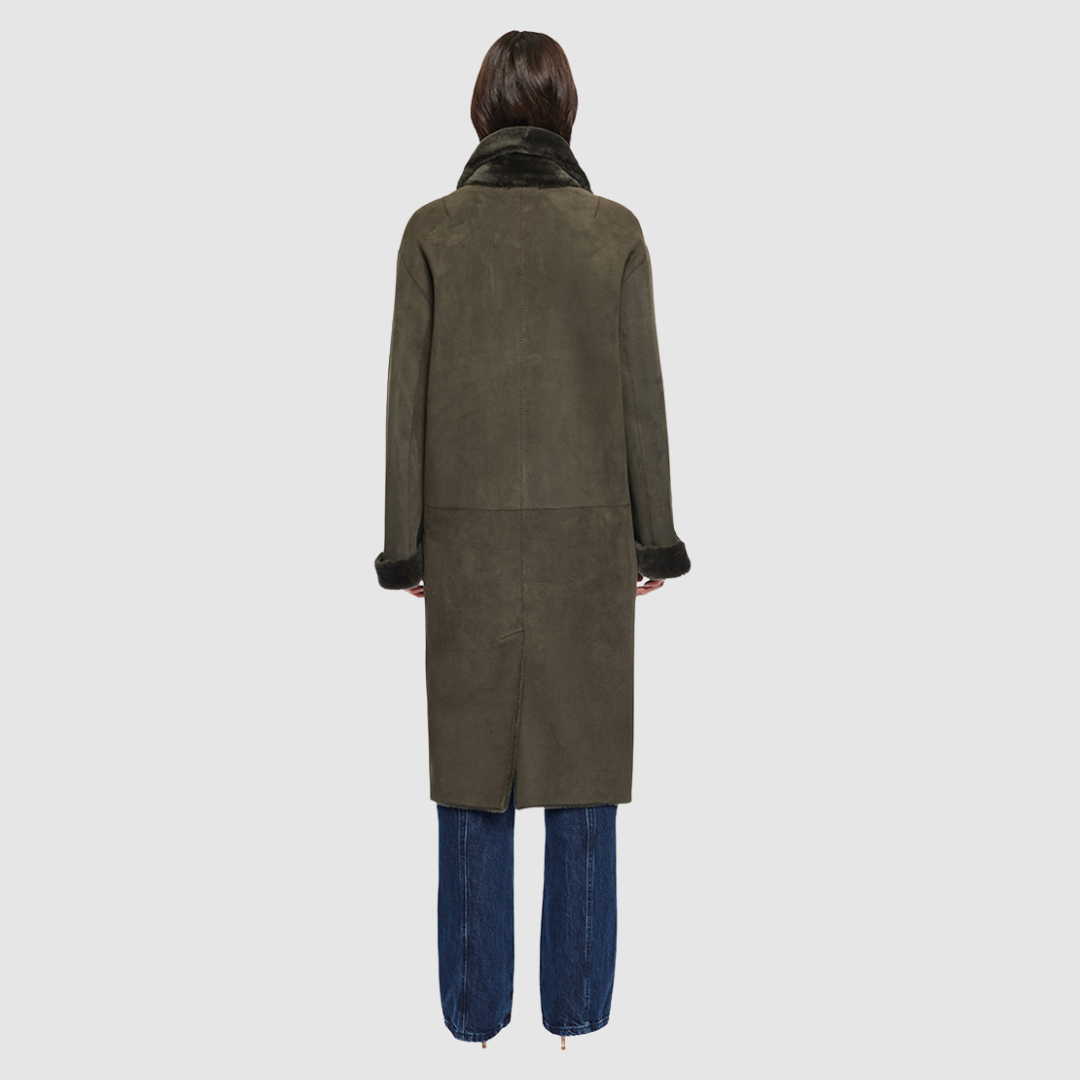 The ELLE Coat is a heritage-inspired oversized reversible shearling piece crafted in khaki suede and ironed wool teddy. Designed to transition seamlessly from smooth suede to plush wool-out texture