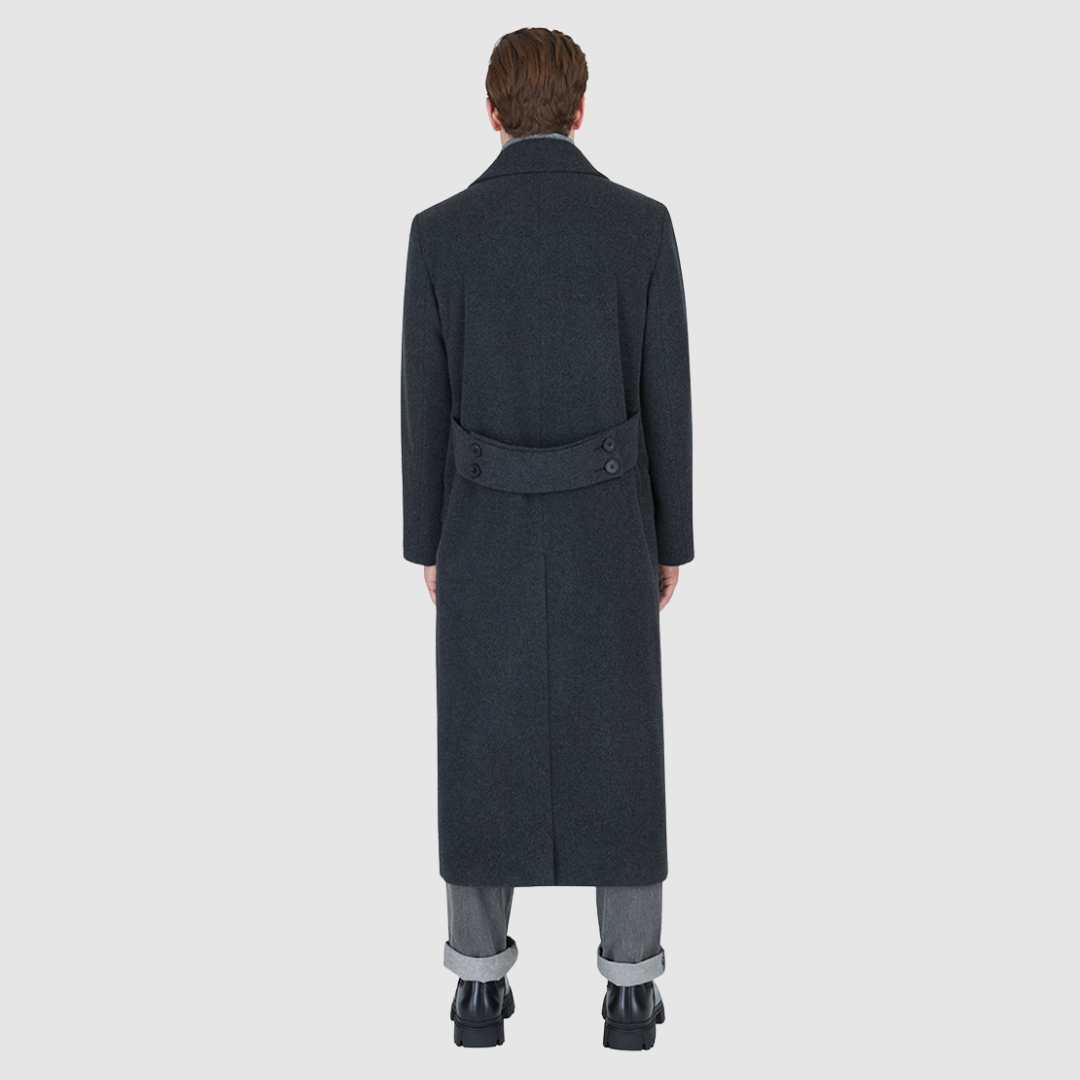 The RYDER Charcoal Coat redefines outerwear with a balance of heritage tailoring and modern ease. Crafted from an Italian wool–cashmere blend, it offers a refined drape with a double-breasted silhouette and relaxed kimono gusset sleeves. A drop shoulder and oversized notch collar add a contemporary edge, while the back vent ensures movement and comfort. Designed with timeless versatility, RYDER is a statement of understated sophistication for city wear.