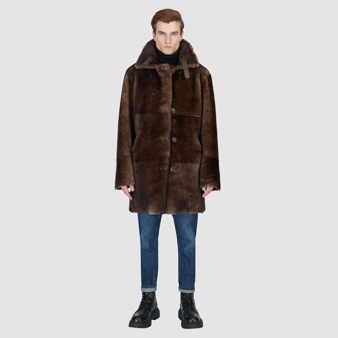 The Edson Burma Reversible Shearling Jacket is a mid-length men’s coat engineered for winter warmth and versatile styling. Crafted from luxe nappa with a plush ironed wool teddy reverse, it delivers two distinct silhouettes: structured and tailored when nappa-out, or relaxed and oversized when wool-out. Designed with a spread collar, raw edge detailing, and functional dual pockets, this jacket provides effortless layering and superior cold-weather protection. Edson balances timeless shearling craftsmanship