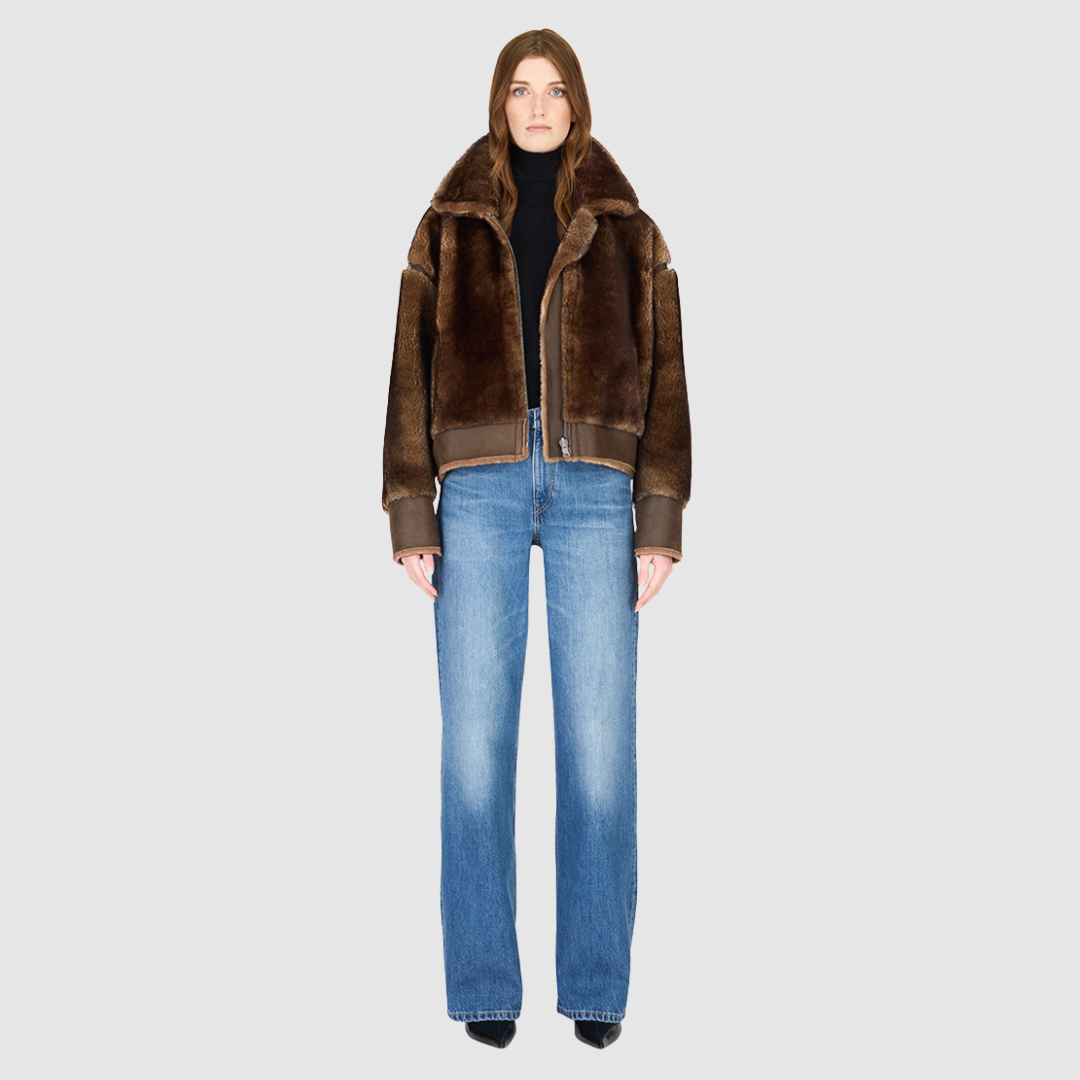 Reversible oversized cropped jacket curly wool and nappa combination Drop shoulder Tapered at hem Standard front zip closure Side and interior zip pockets