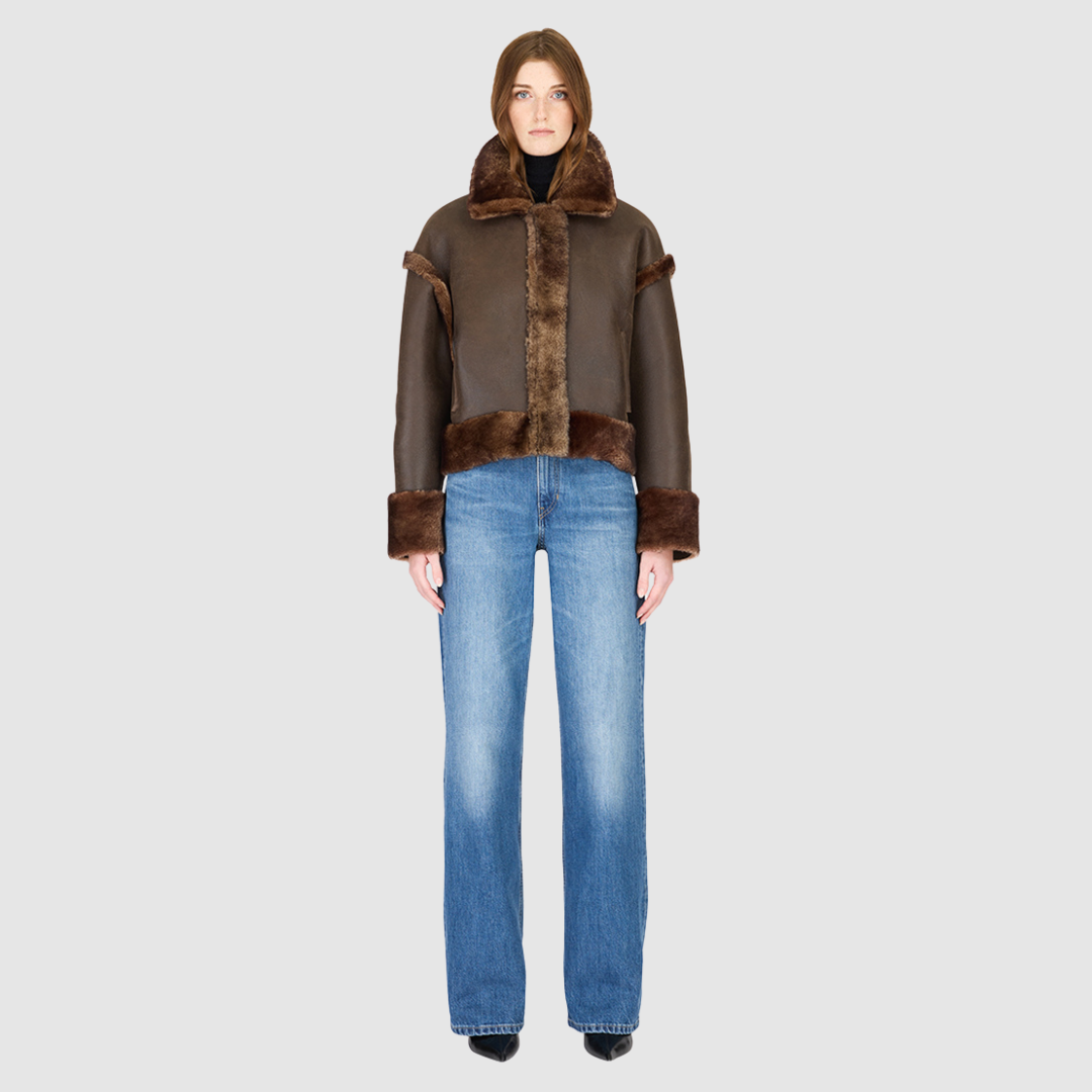 Reversible oversized cropped jacket curly wool and nappa combination Drop shoulder Tapered at hem Standard front zip closure Side and interior zip pockets