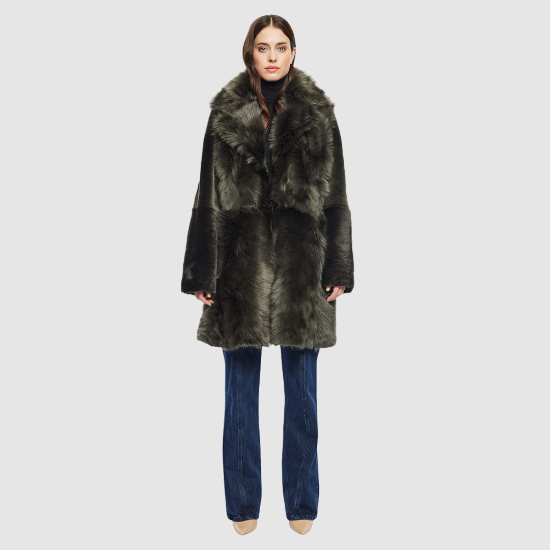 The GIPSI Reversible Shearling Jacket offers a modern take on the parka, combining rugged function with luxurious texture. Crafted in khaki suede that reverses to a plush Toscana wool teddy, it delivers two distinct looks in one. Designed with a regular shoulder and oversized Toscana notch collar, it balances structure with relaxed ease. Raw-edge hems and versatile pocketing lend utility to this semi-fitted style, making GIPSI ideal for heritage outerwear lovers and après-ski wardrobes alike.