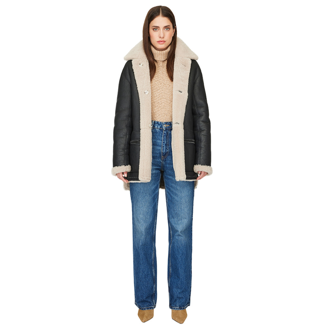 Reversible nappa shacket Reverses to curly wool teddy Drop shoulder High-low hemline Notch collar Side zip pockets on nappa side Side patch pockets on curly wool side 4 button closure