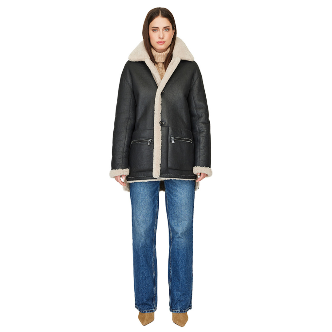 Reversible nappa shacket Reverses to curly wool teddy Drop shoulder High-low hemline Notch collar Side zip pockets on nappa side Side patch pockets on curly wool side 4 button closure
