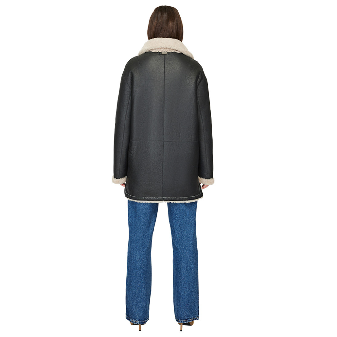 Reversible nappa shacket Reverses to curly wool teddy Drop shoulder High-low hemline Notch collar Side zip pockets on nappa side Side patch pockets on curly wool side 4 button closure