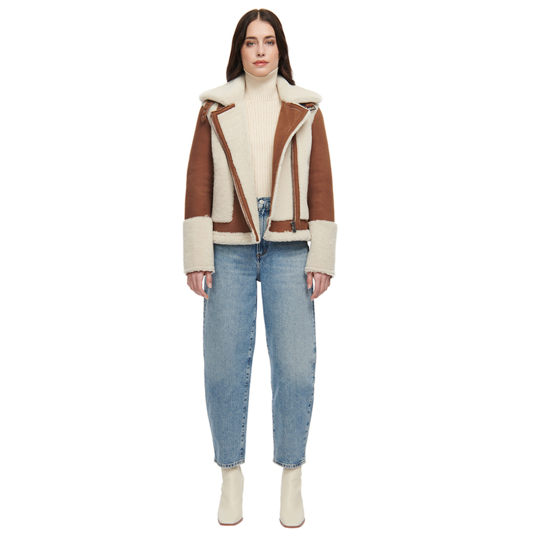 Nappa curly wool shearling moto Drop shoulder Wool out cuff detail & sheared wool body and sleeves Curly wool collar with double buckle detail Asymmetrical front zip closure Side and interior zip pockets