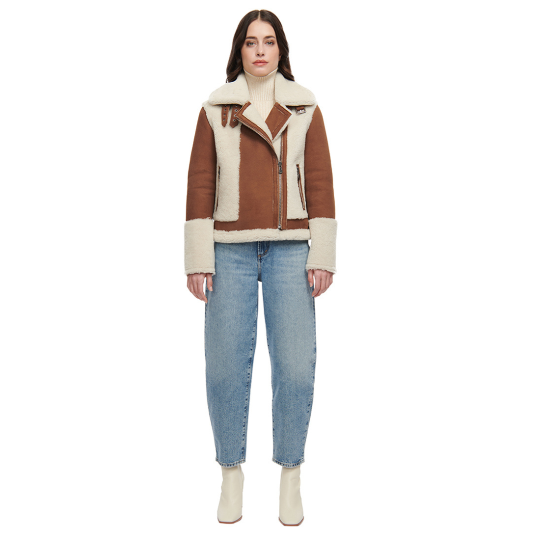 Nappa curly wool shearling moto Drop shoulder Wool out cuff detail & sheared wool body and sleeves Curly wool collar with double buckle detail Asymmetrical front zip closure Side and interior zip pockets