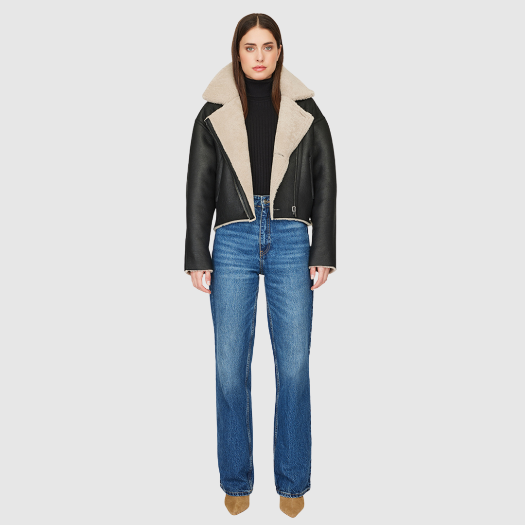 Reversible nappa cropped relaxed moto Reverses to curly wool teddy Drop shoulder Relaxed bat wing sleeves Oversized notch collar Single welt side pockets on nappa side Slash pockets on curly wool side Asymmetrical front zip and single button closure