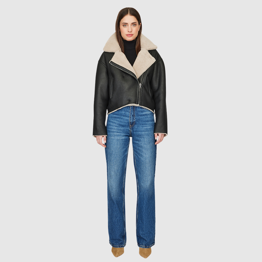 Reversible nappa cropped relaxed moto Reverses to curly wool teddy Drop shoulder Relaxed bat wing sleeves Oversized notch collar Single welt side pockets on nappa side Slash pockets on curly wool side Asymmetrical front zip and single button closure