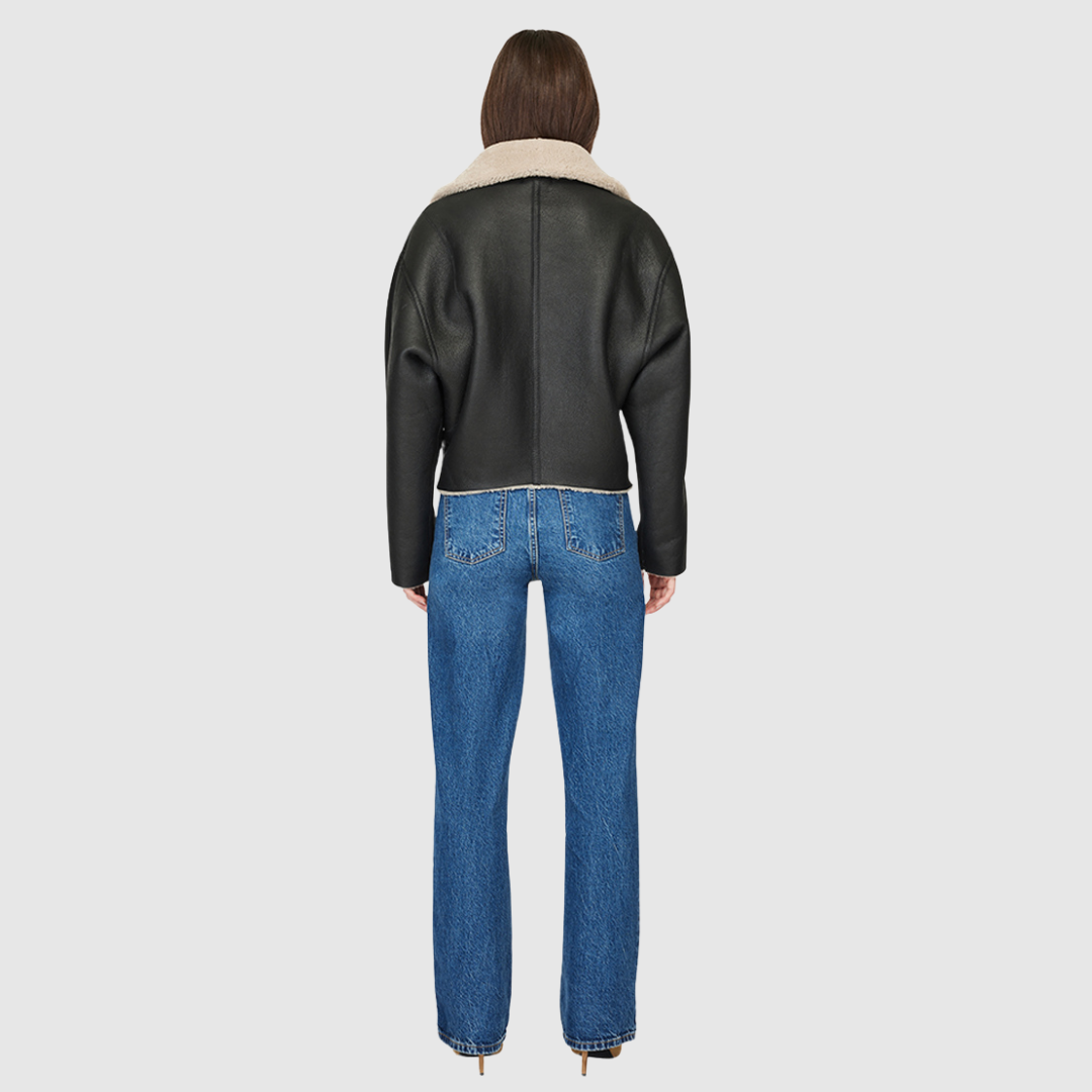 Reversible nappa cropped relaxed moto Reverses to curly wool teddy Drop shoulder Relaxed bat wing sleeves Oversized notch collar Single welt side pockets on nappa side Slash pockets on curly wool side Asymmetrical front zip and single button closure