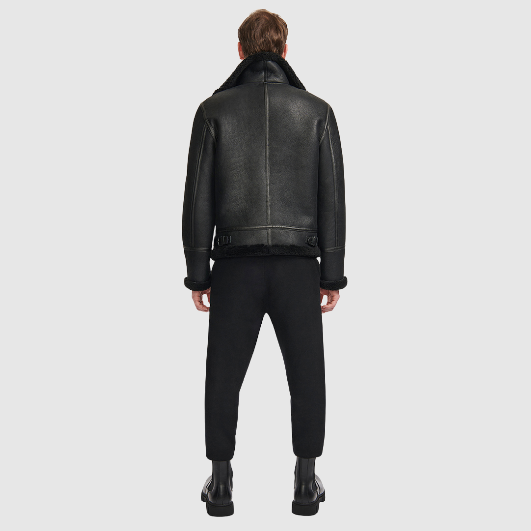 Classic nappa aviator shearling Curly wool collar and trims Large welt pockets and stitch detail Buckle details on collar and waistband Zipper closure Standard fit