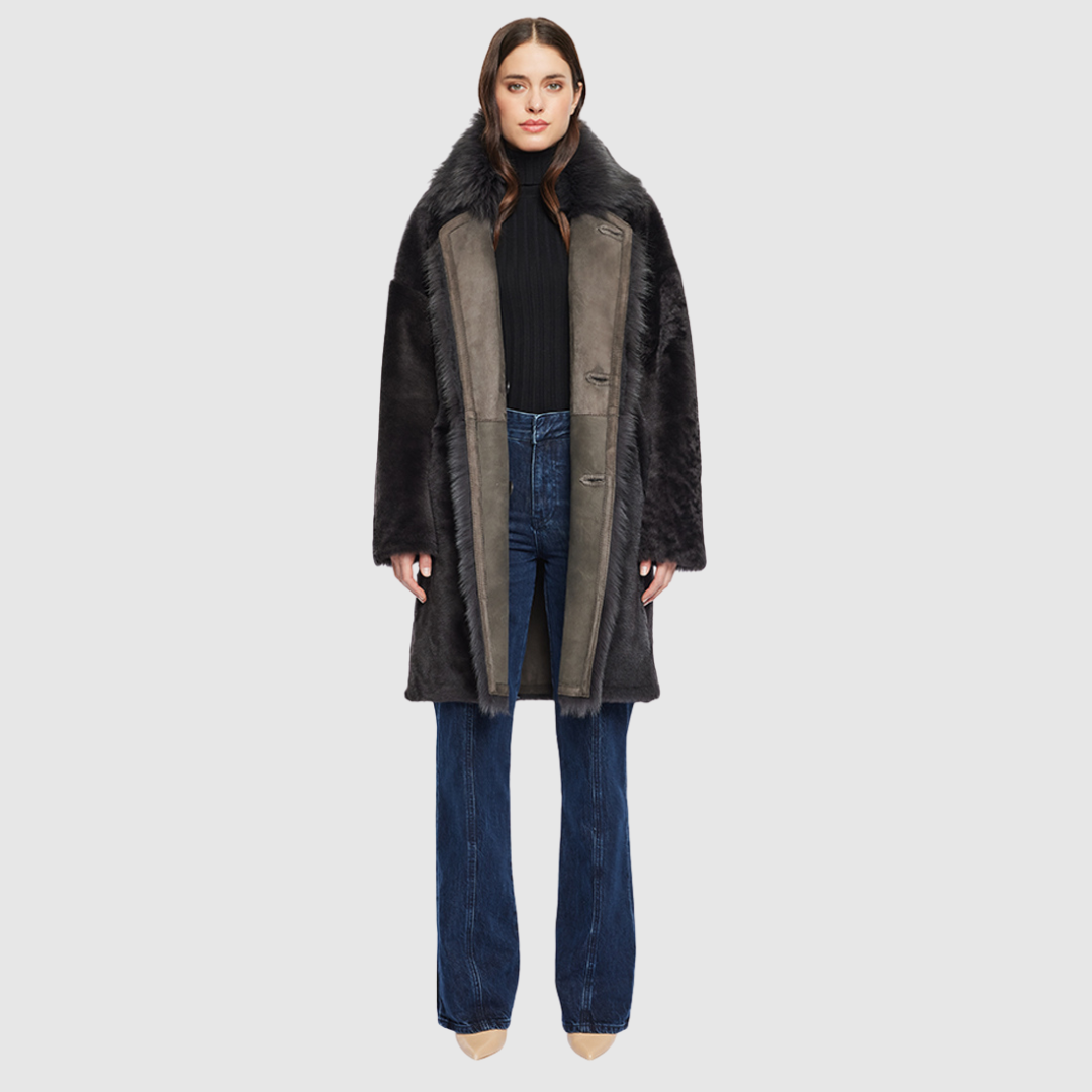 Reversible suede loose fitting coat Reverses to iron wool teddy Slight drop shoulder Double breasted button closure