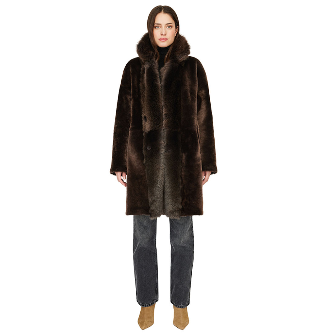 Reversible suede loose fitting coat Reverses to iron wool teddy Slight drop shoulder Double breasted button closure