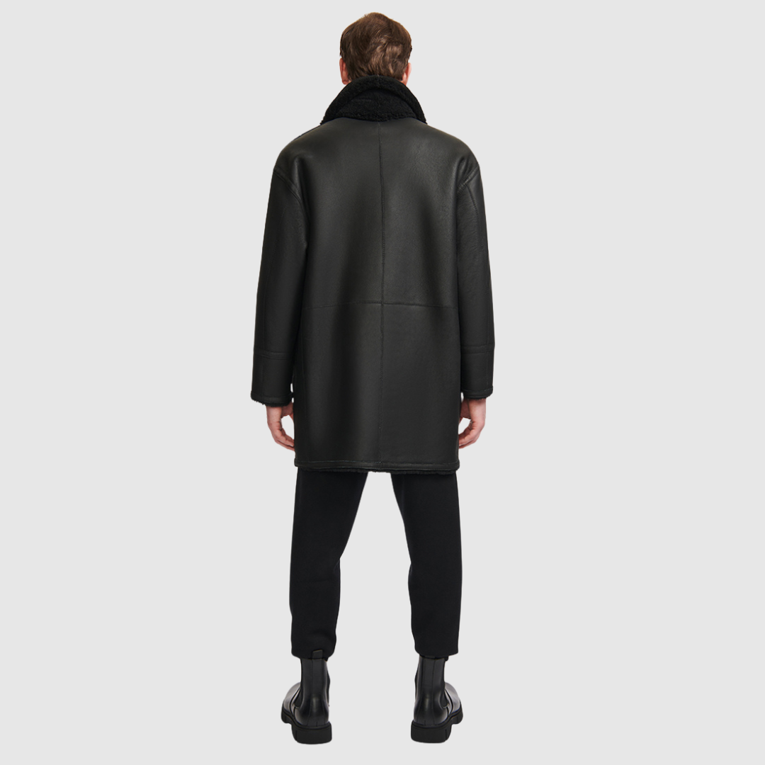 Oversized reversible nappa moto Reverses to a curly wool teddy Drop shoulder Oversized fit through shoulders, arms and body Notch collar with buckle details Single welt side pockets on nappa side Patch side pockets on curly wool teddy side Front zip and button closure