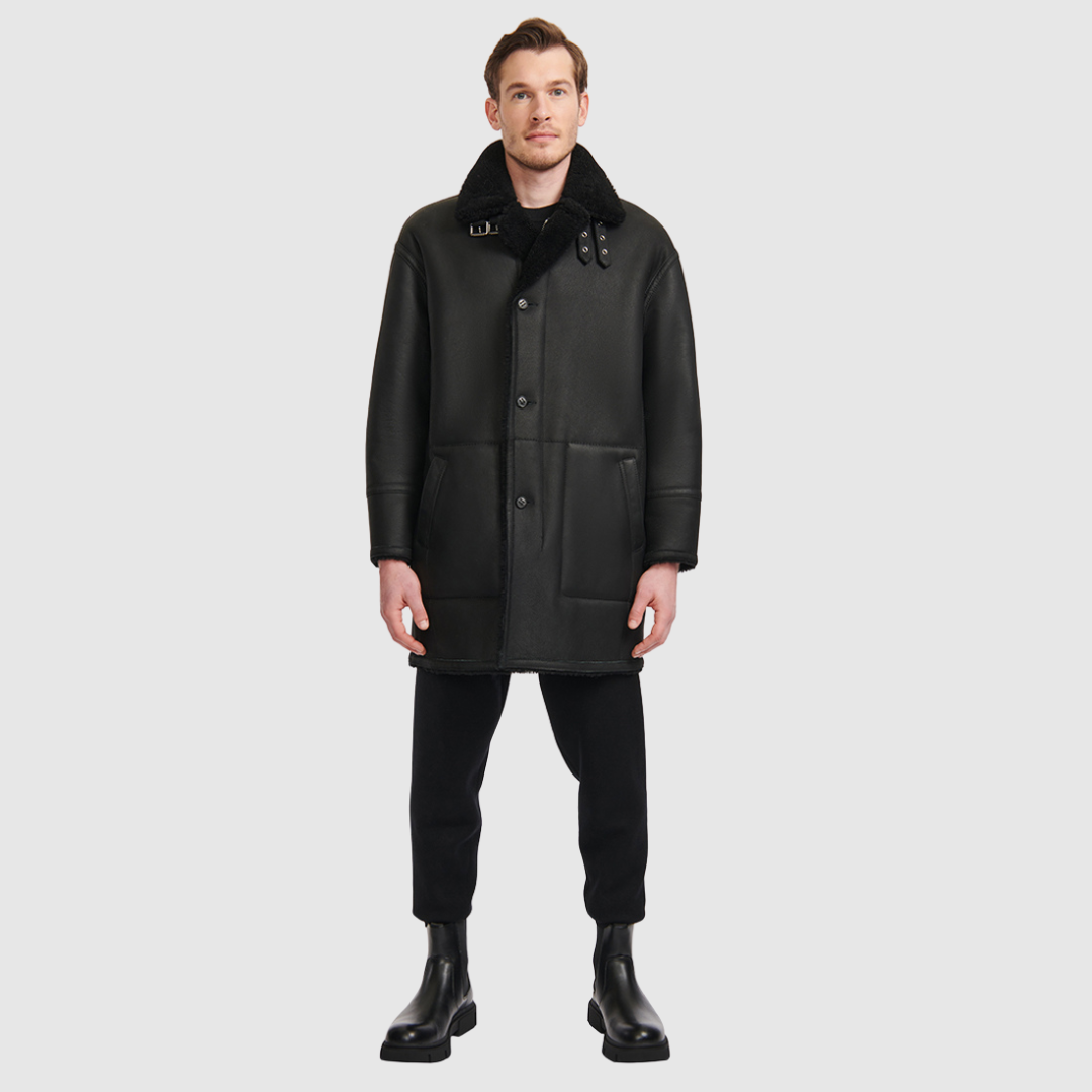 Oversized reversible nappa moto Reverses to a curly wool teddy Drop shoulder Oversized fit through shoulders, arms and body Notch collar with buckle details Single welt side pockets on nappa side Patch side pockets on curly wool teddy side Front zip and button closure