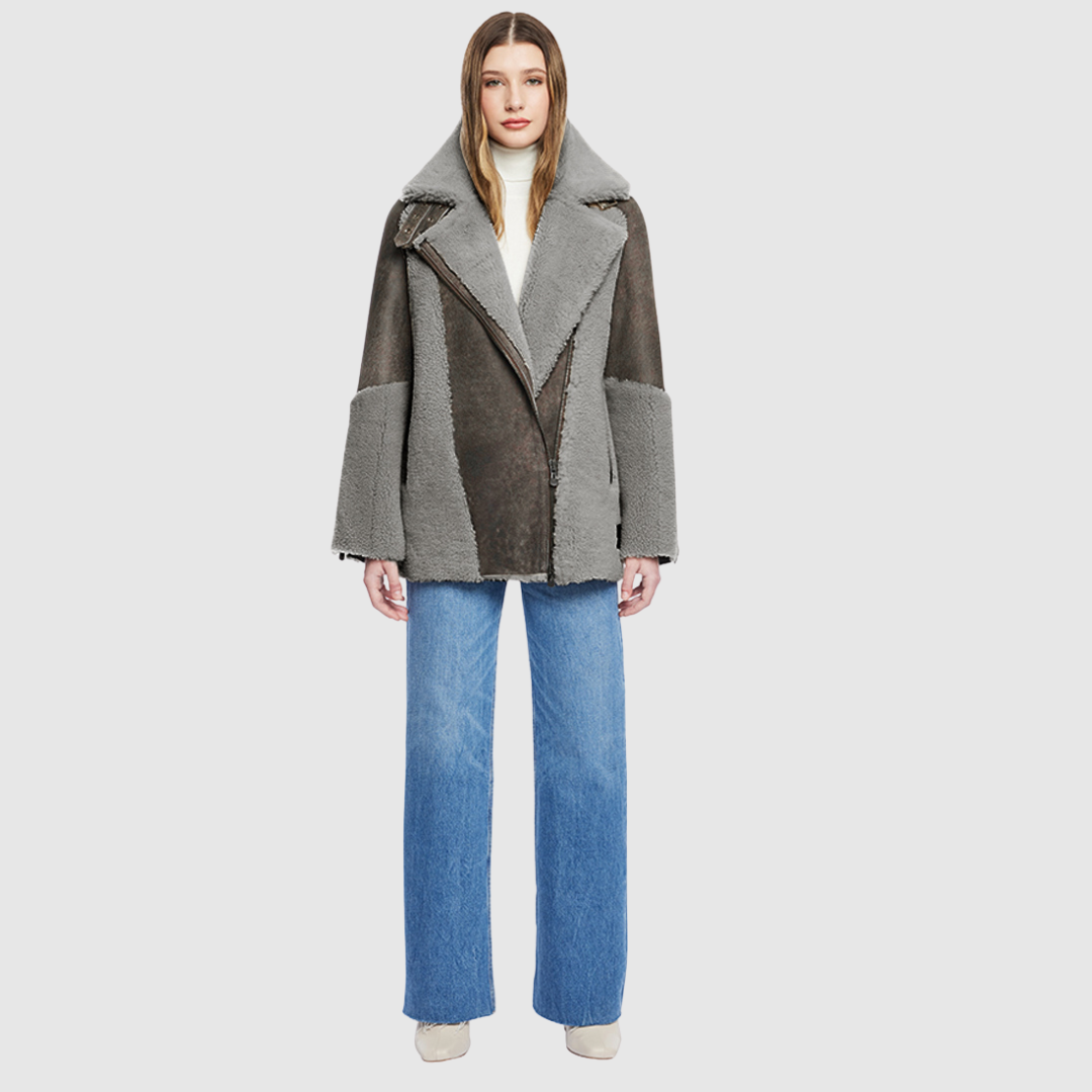 Curly wool and nappa mixed media coat Drop shoulder Oversized loose fitted style Curly wool detail on body and sleeve cuff Deep armhole and wide sleeves Straight fit Asymmetrical front zip closure Exterior zip pockets Hidden inside pockets