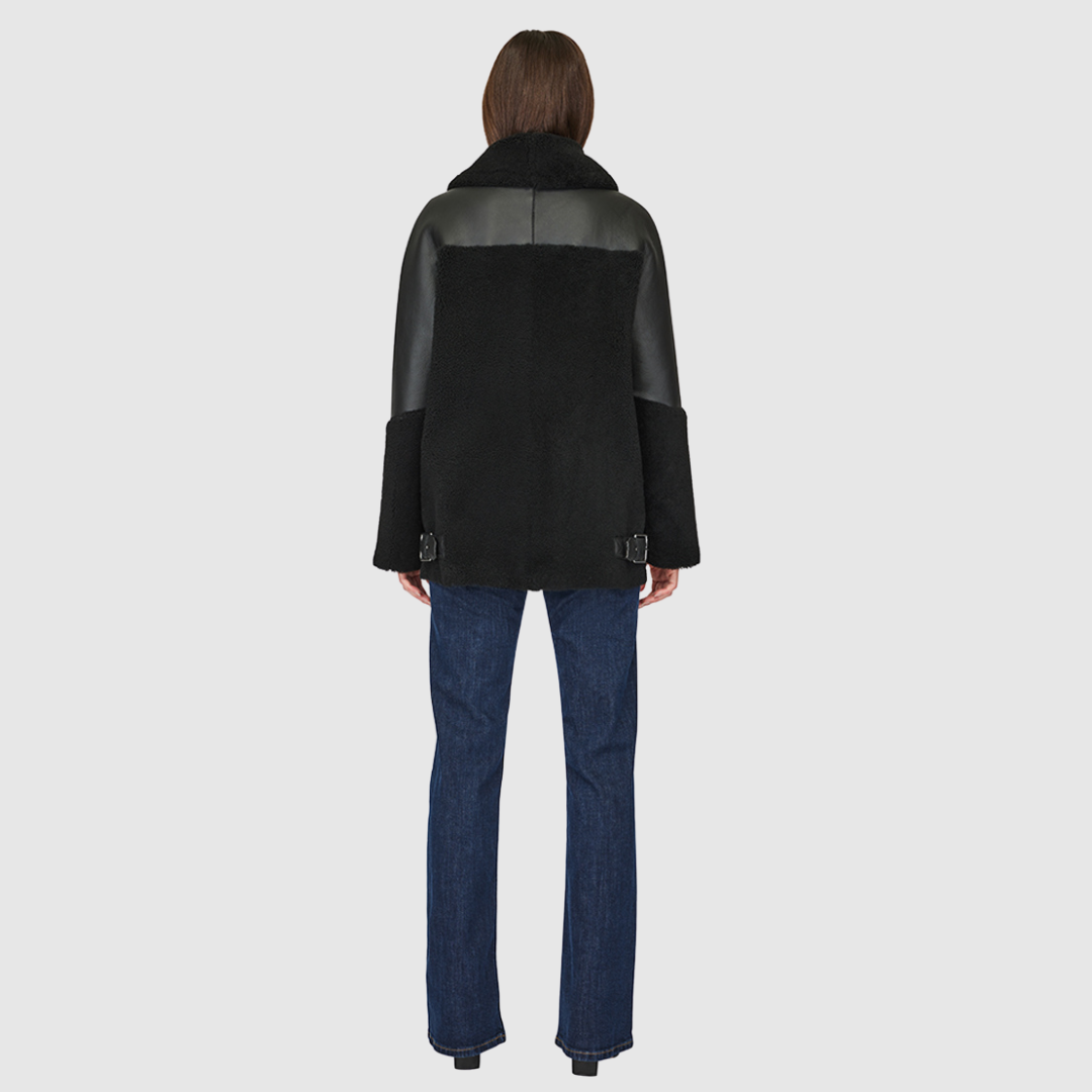 Curly wool and nappa mixed media coat Drop shoulder Oversized loose fitted style Curly wool detail on body and sleeve cuff Deep armhole and wide sleeves Straight fit Asymmetrical front zip closure Exterior zip pockets Hidden inside pockets