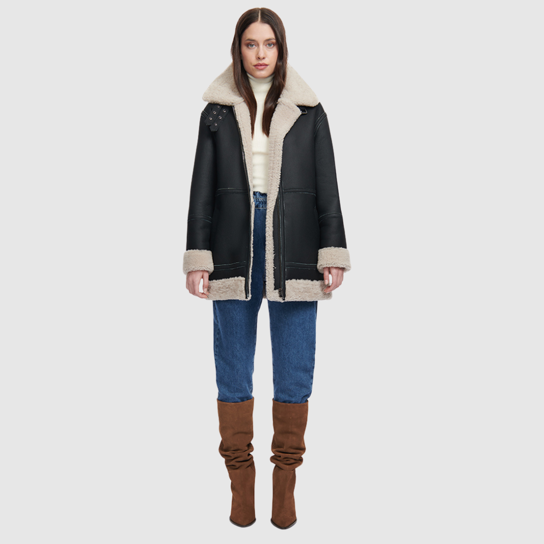 Nappa curly wool shearling Reversible relaxed medium length nappa moto Reverses to curly wool teddy Drop shoulder Curly wool collar and trims Straight fit Patch pockets on both skin-out and reversed wool-out sides Front zip closure