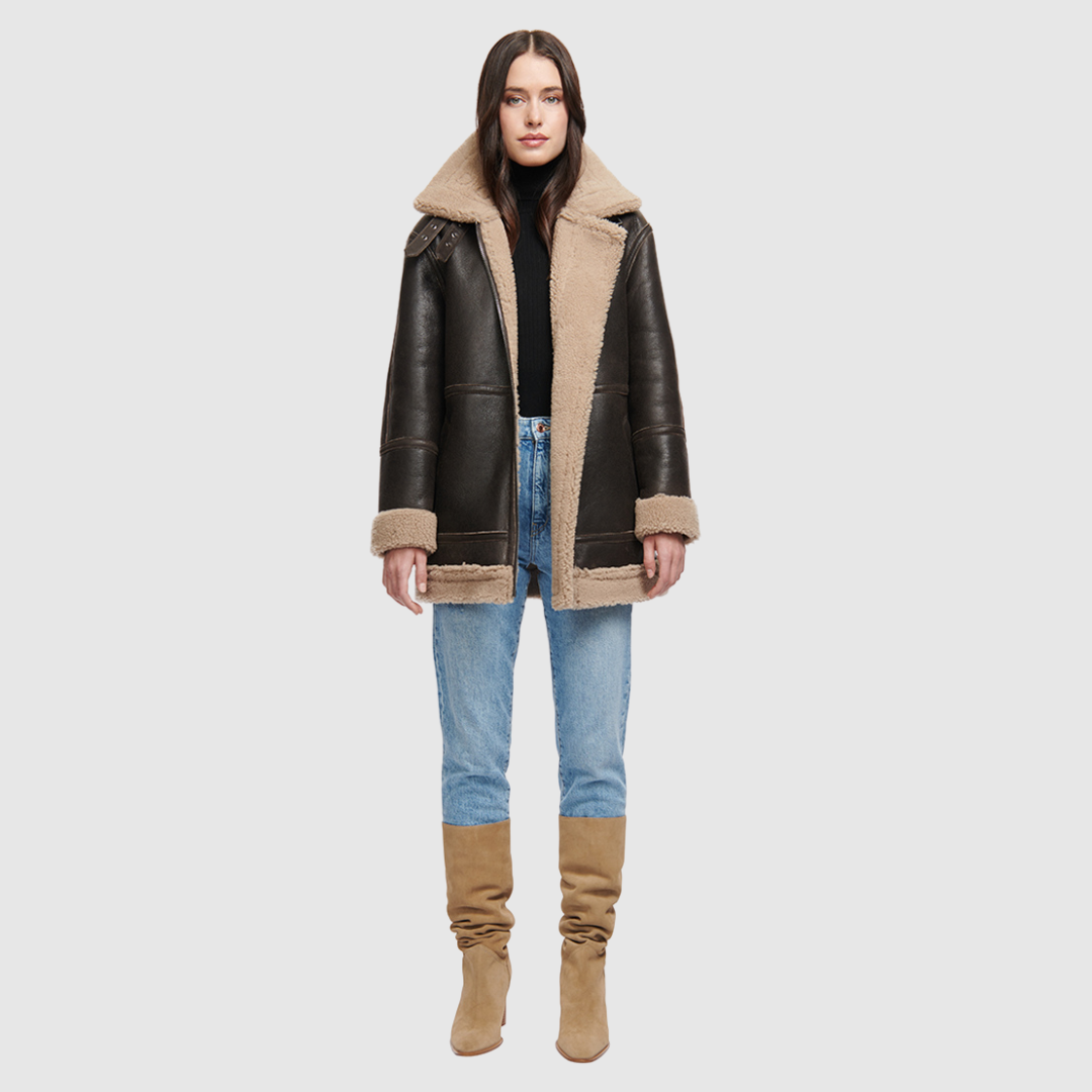Nappa curly wool shearling Reversible relaxed medium length nappa moto Reverses to curly wool teddy Drop shoulder Curly wool collar and trims Straight fit Patch pockets on both skin-out and reversed wool-out sides Front zip closure