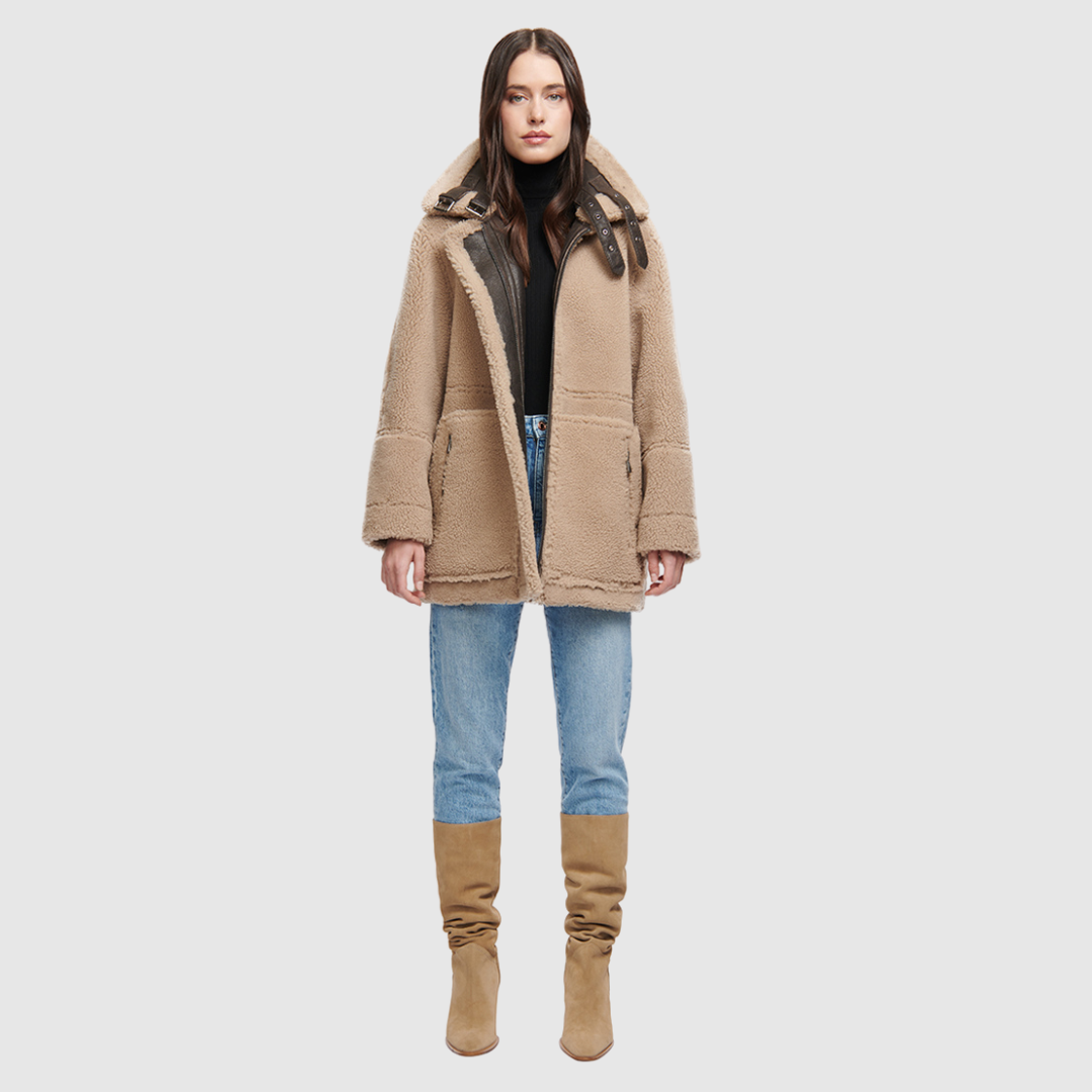 Nappa curly wool shearling Reversible relaxed medium length nappa moto Reverses to curly wool teddy Drop shoulder Curly wool collar and trims Straight fit Patch pockets on both skin-out and reversed wool-out sides Front zip closure