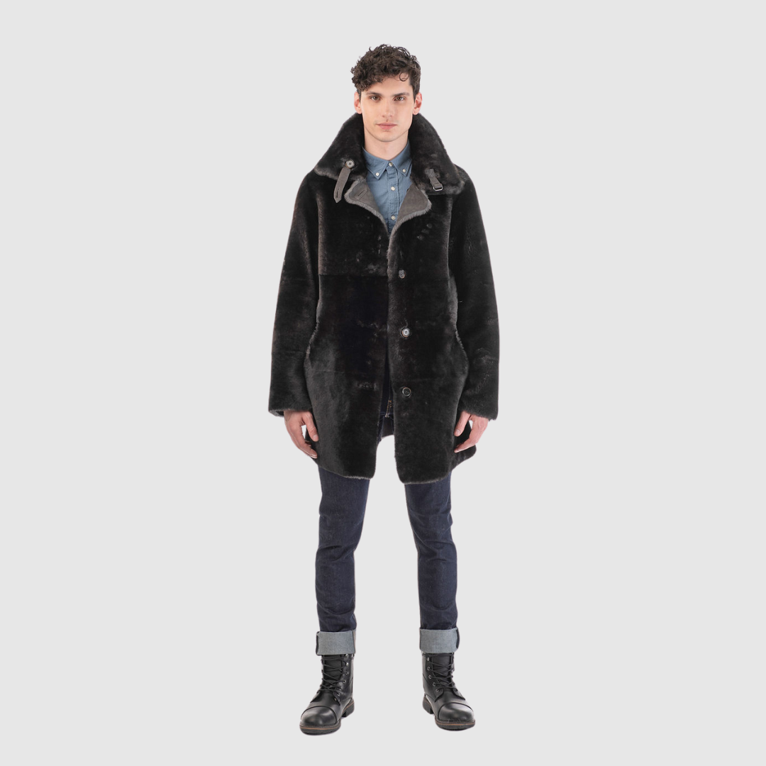 Reversible shearling suede medium length coat Reverses back to iron wool teddy Fits true to size when worn skin out Fits looser when worn wool out Raw edge finish Spread collar with tab Single welt side pocket on suede side Slash side pocket on iron wool side Single breasted button closure