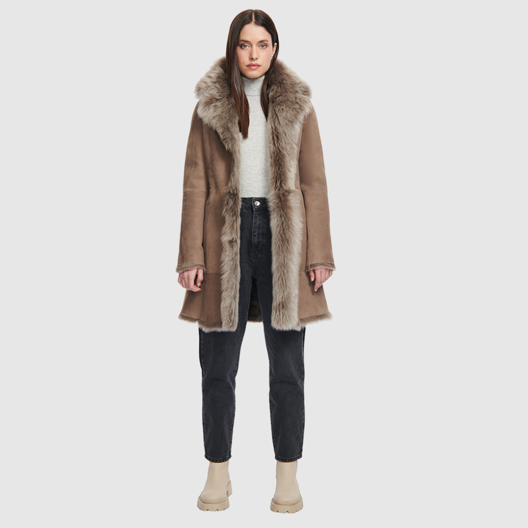 Reversible suede semi fitted parka with raw edge hems. Reverses to toscana teddy. Front snap closure.