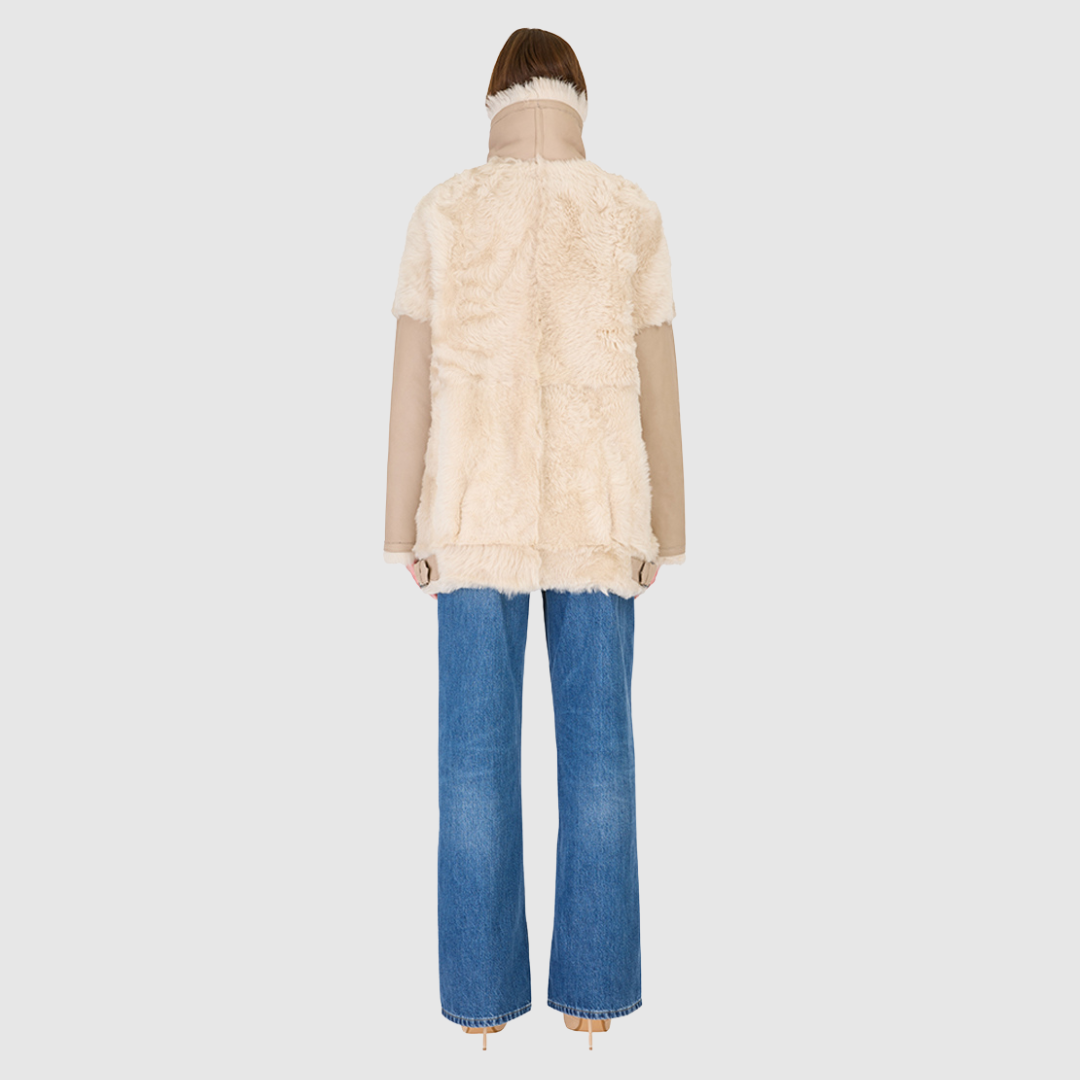 Mixed media nappa moto Contrast toscana wool detailing on shoulders and body Large curly toscana notch collar Relaxed fit through shoulder and torso Buckle detailing on collar and bottom trims Side and interior zip pockets Asymmetrical front zip closure