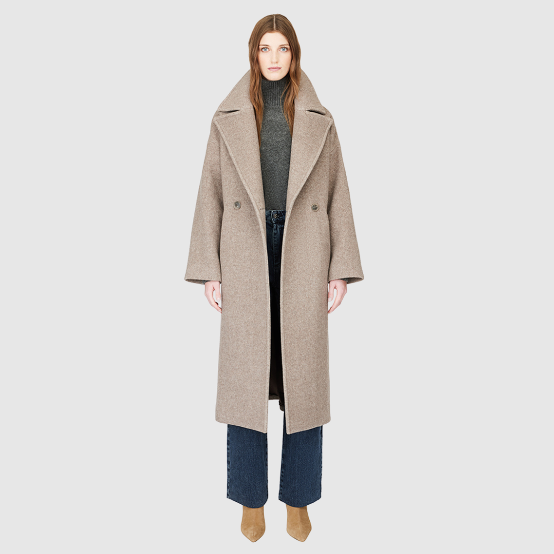 The ISABELLA Taupe Wool Coat is crafted from a luxurious Italian wool-cashmere blend, designed with a relaxed, oversized silhouette. Its double-breasted closure and drop-shoulder construction create an effortlessly modern drape, while kimono gusset sleeves add fluidity and ease of movement. A large notch collar and single welt pockets complete the look, making ISABELLA a timeless statement piece in contemporary outerwear.
