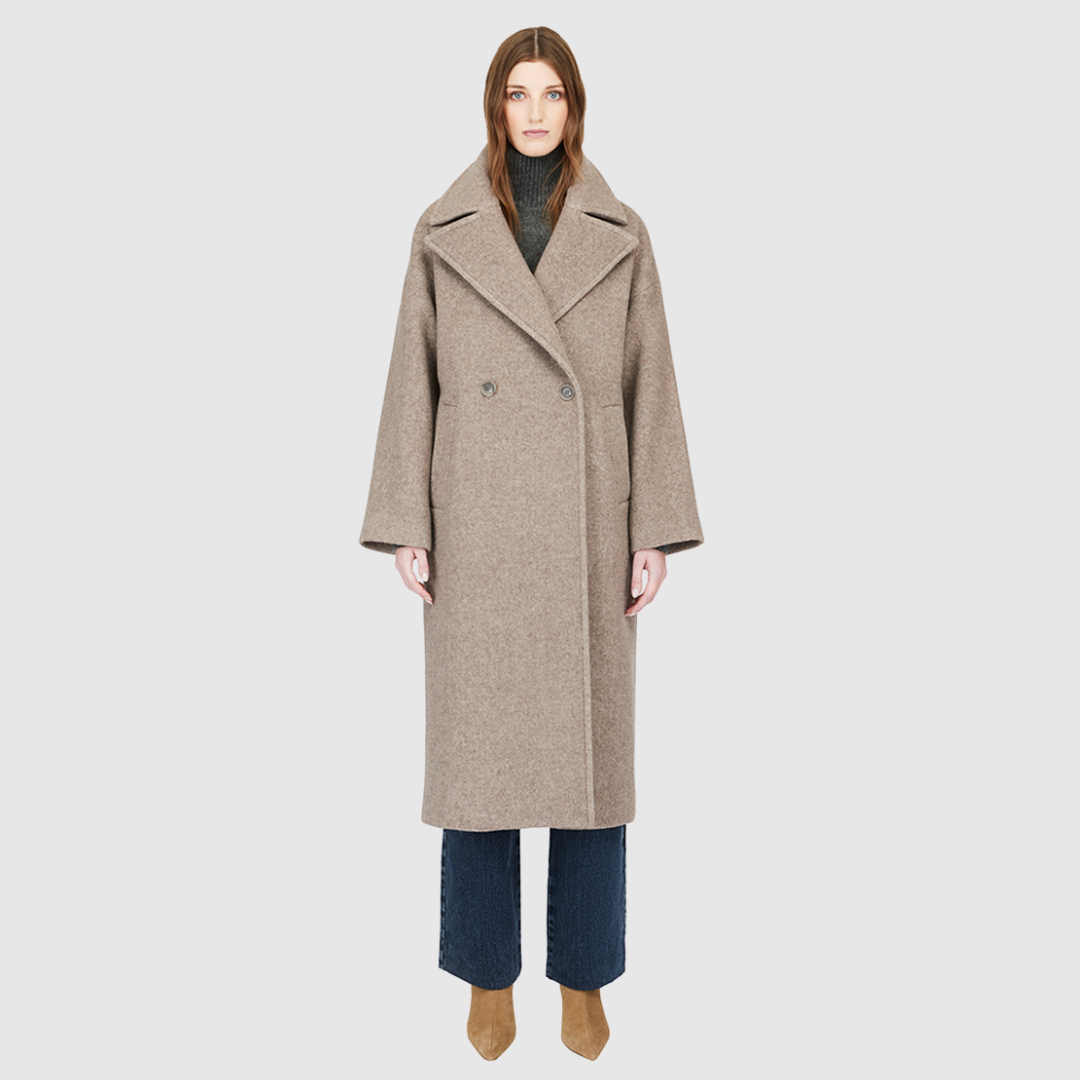The ISABELLA Taupe Wool Coat is crafted from a luxurious Italian wool-cashmere blend, designed with a relaxed, oversized silhouette. Its double-breasted closure and drop-shoulder construction create an effortlessly modern drape, while kimono gusset sleeves add fluidity and ease of movement. A large notch collar and single welt pockets complete the look, making ISABELLA a timeless statement piece in contemporary outerwear.