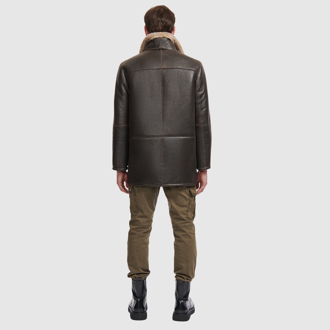 Shearling nappa with curly wool Straight cut through the torso Zippered stand collar Two way zip closure Buttoned placket Interior zip pocket Regular fit