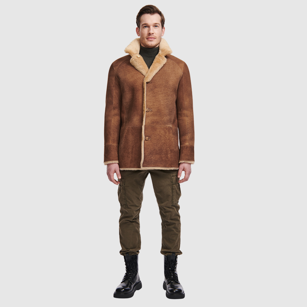 Reversible shearling relaxed fitting suede coat Reverses to iron wool teddy Drop shoulder When worn wool in, fitted on the shoulders and chest, straight cut through the torso When worn wool out, relaxed fit through the shoulder and body Notch collar Raw edge finish Single breasted 3 button closure Slash side pockets on both suede side and reversed iron wool side