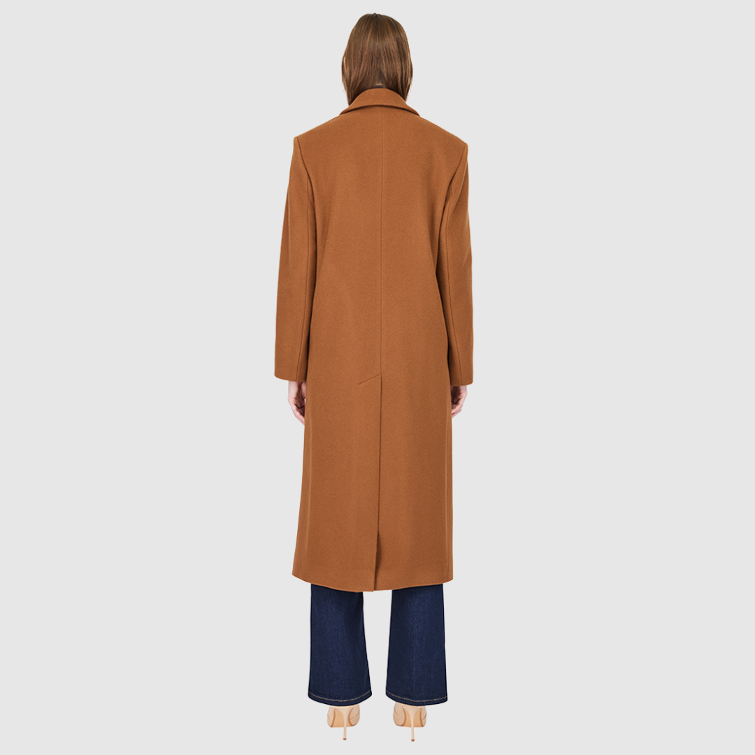 Italian wool cashmere blend Double breasted Fitted through shoulders and arms, looser through torso Spread collar Back vent Single welt pockets