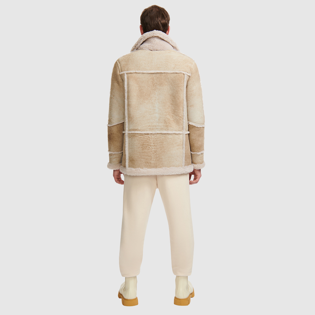 Mixed media parka Slightly oversized fit Contrast curly wool out detail Regular shoulder Zip closure Oversized patch pockets