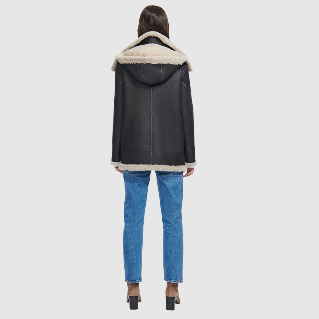 Relaxed medium length nappa moto shearling Drop shoulder Curly wool collar and trims Interior zip pocket