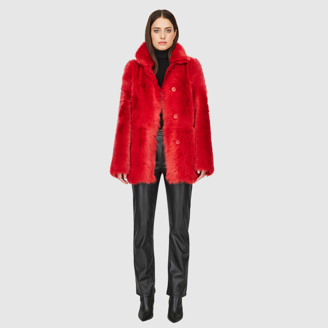 This HiSO Milky Way Racing Red Reversible Shearling Teddy is versatile and stylish. It can be worn with a relaxed fit showcasing the wool-out side, or with a regular fit highlighting the suede side. The jacket features a spread collar, slash side pockets on the toscana teddy side, and patch side pockets on the suede side. It is secured with a front button closure.
