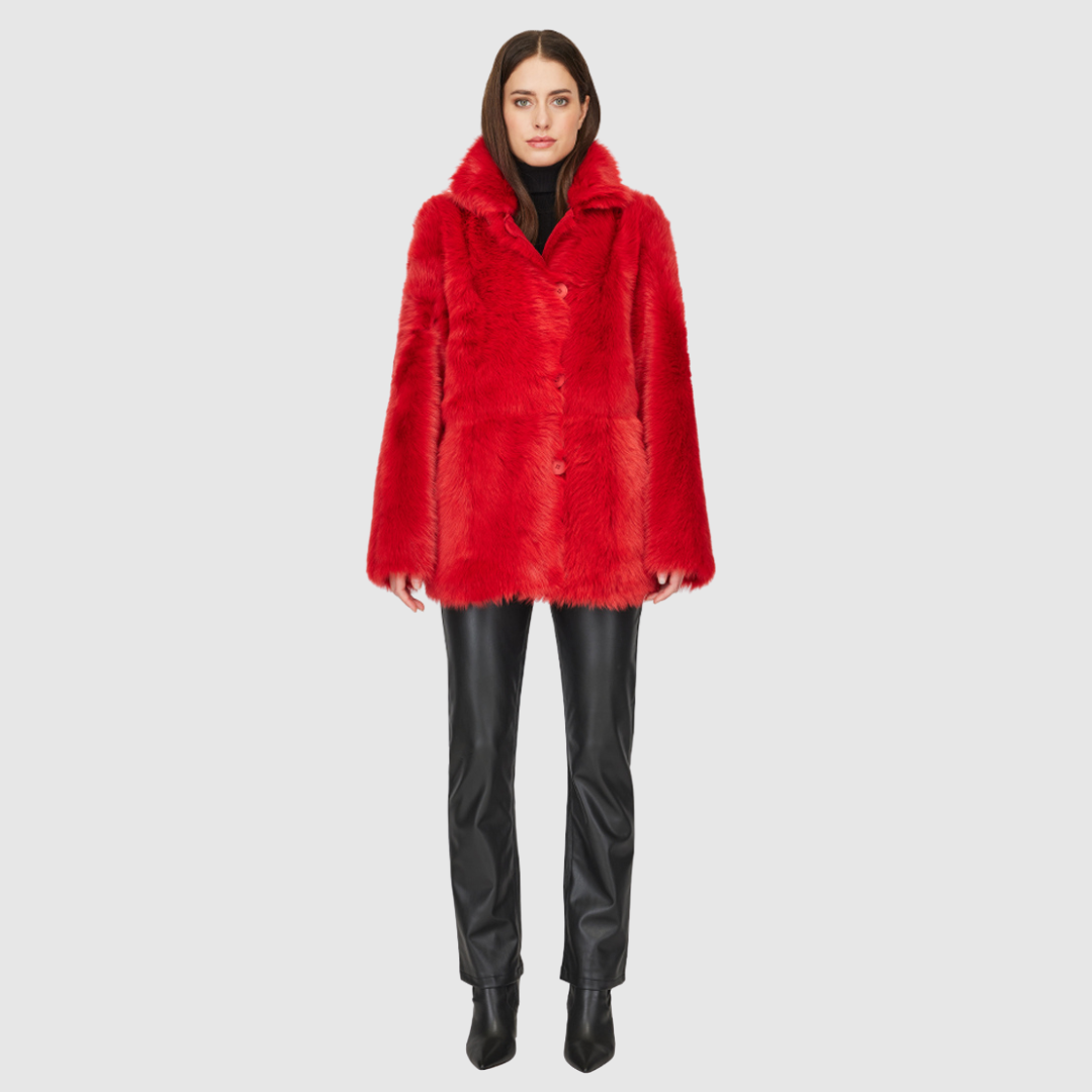 This HiSO Milky Way Racing Red Reversible Shearling Teddy is versatile and stylish. It can be worn with a relaxed fit showcasing the wool-out side, or with a regular fit highlighting the suede side. The jacket features a spread collar, slash side pockets on the toscana teddy side, and patch side pockets on the suede side. It is secured with a front button closure.