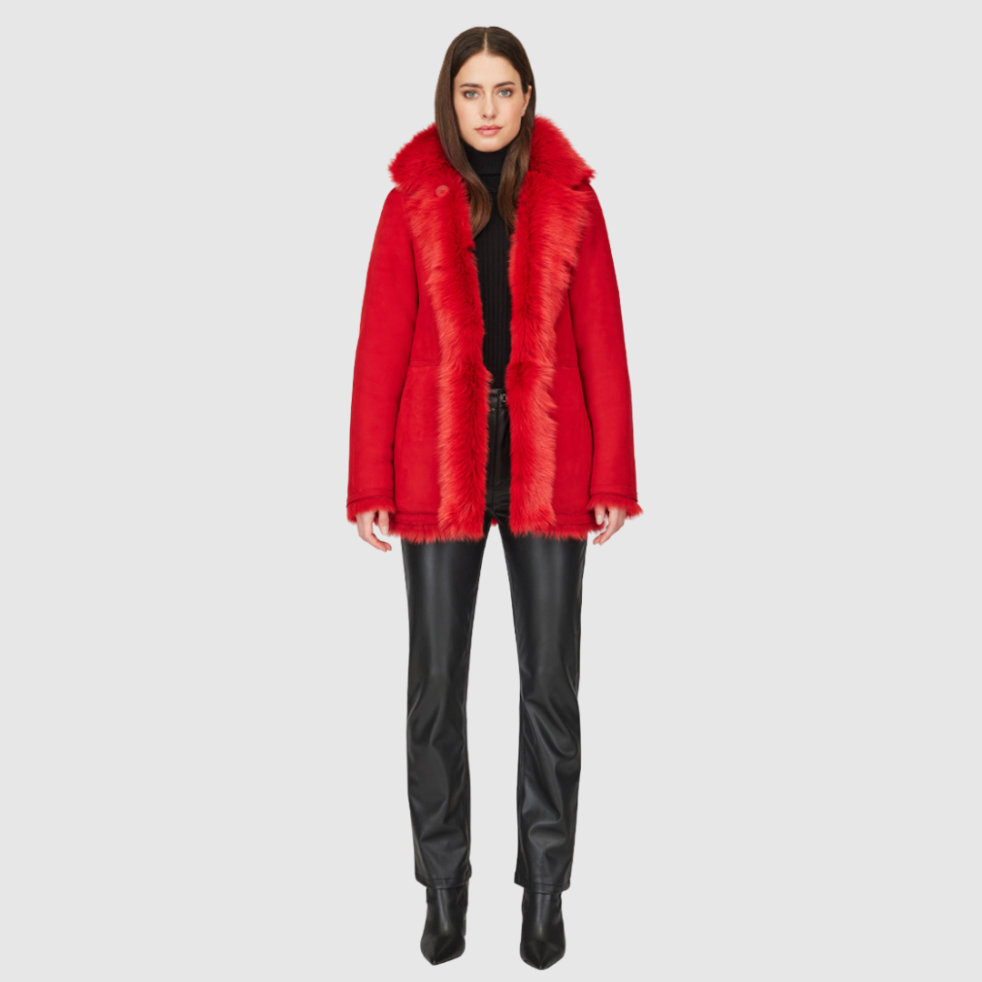 This HiSO Milky Way Racing Red Reversible Shearling Teddy is versatile and stylish. It can be worn with a relaxed fit showcasing the wool-out side, or with a regular fit highlighting the suede side. The jacket features a spread collar, slash side pockets on the toscana teddy side, and patch side pockets on the suede side. It is secured with a front button closure.