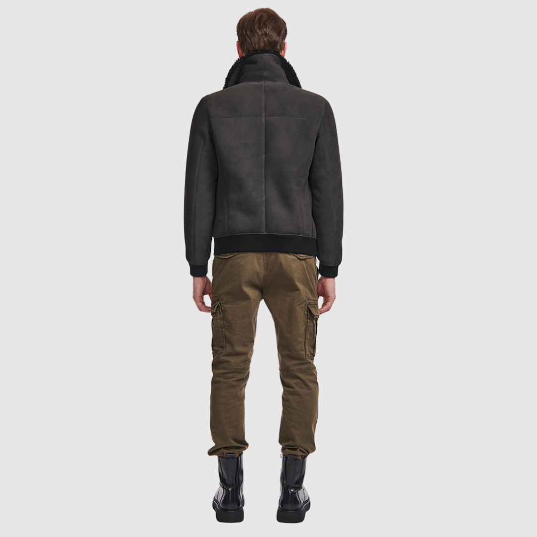 Suede bomber with curly wool collar Fits true to size Rib cuffs and waistband Standard zip closure Zip pockets Interior zip pocket