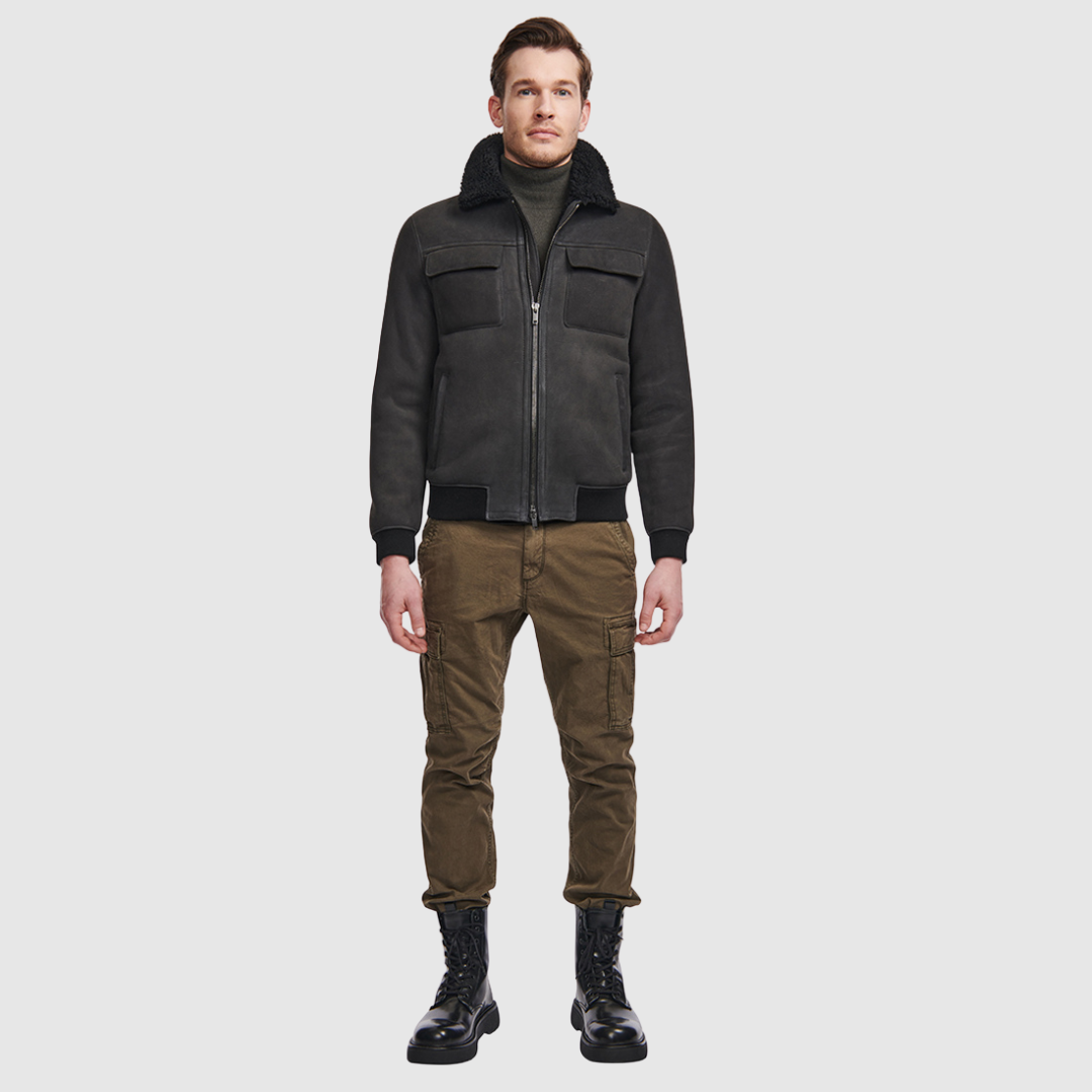 Suede bomber with curly wool collar Fits true to size Rib cuffs and waistband Standard zip closure Zip pockets Interior zip pocket