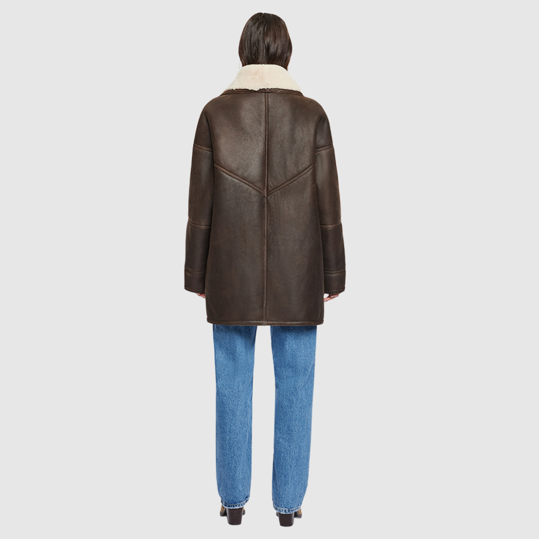 Oversized 80's inspired nappa jacket Drop shoulder Deep armholes and wide sleeves Curly wool shawl collar Interior zip pocket Patch side pockets Front button closure