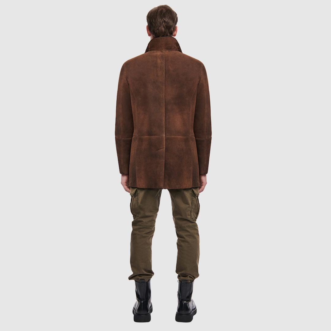 Shearling from Spain Dyed shearling lamb Notch lapel Button placket Exterior lined front pockets Interior zipped pockets Metal and leather logo tag on inside