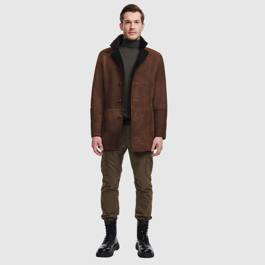 Shearling from Spain Dyed shearling lamb Notch lapel Button placket Exterior lined front pockets Interior zipped pockets Metal and leather logo tag on inside