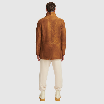  Shearling from Spain toffee outside, fuzzy beige inside  Dyed shearling lamb Notch lapel Button placket Exterior lined front pockets Interior zipped pockets Metal and leather logo tag on inside